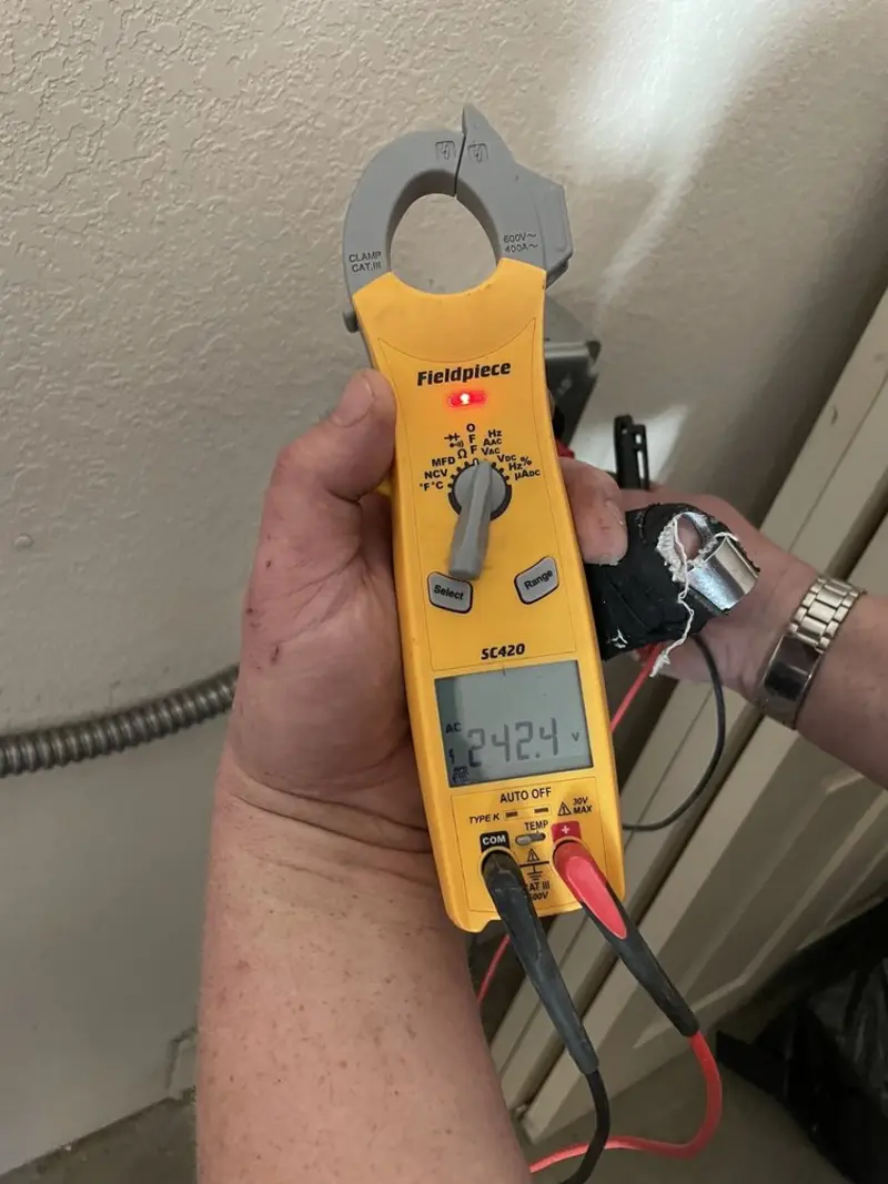 Voltage testing with clamp meter during Ceiling Fan Installation in Dearborn